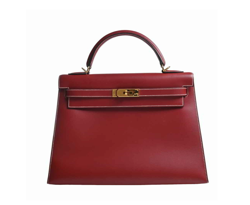 Hermes Kelly 32 handbag in a burgundy, comes with a shoulder strap, clochette, and Cadena