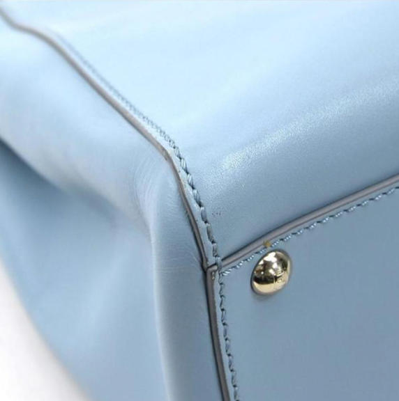 Pre-owned medium Fendi Peekaboo handbag of light blue leather and silver hardware with a long strap