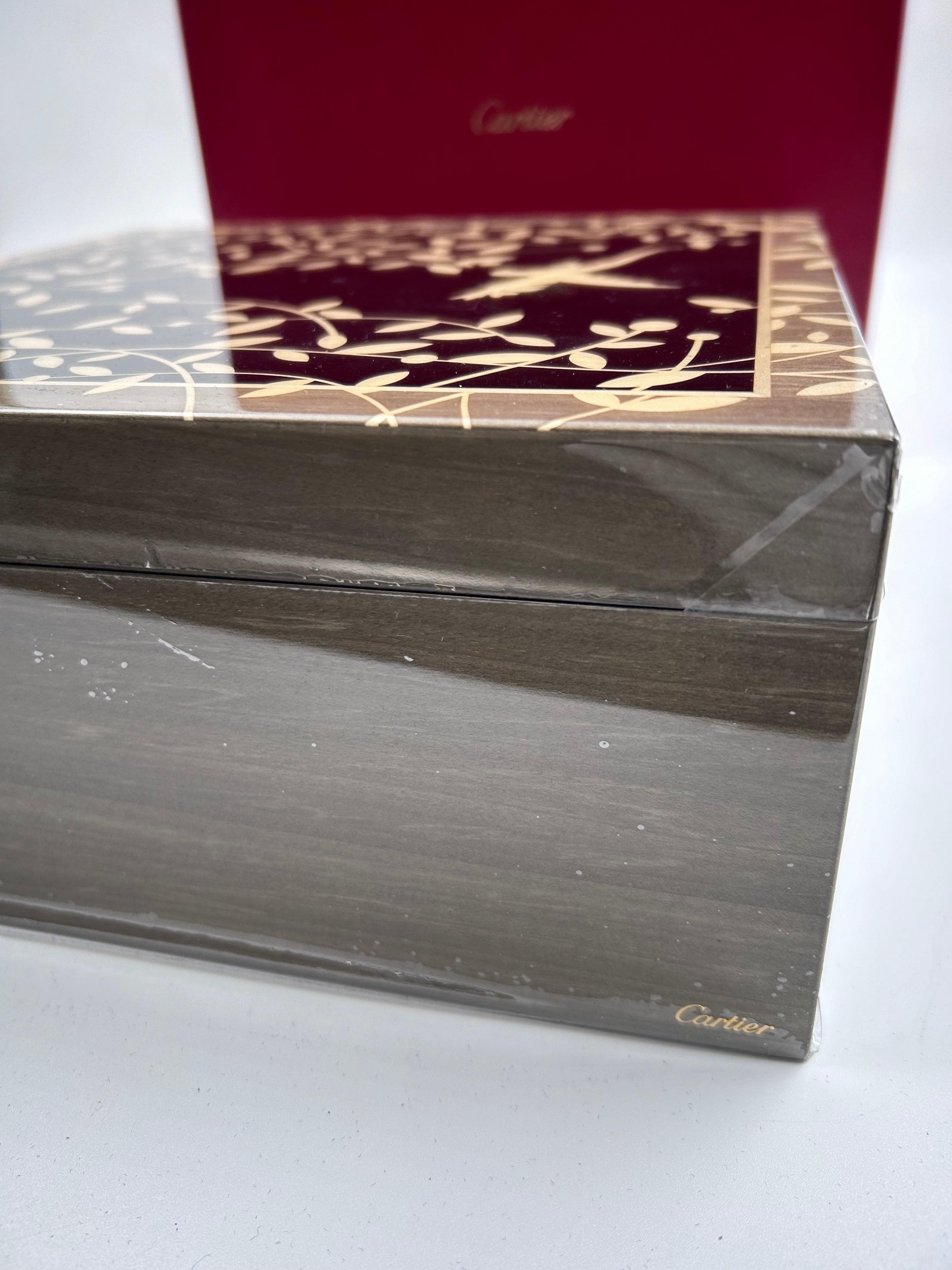 Cartier limited edition jewellery box made of cedar and sycamore wood, featuring an inlay of abalone