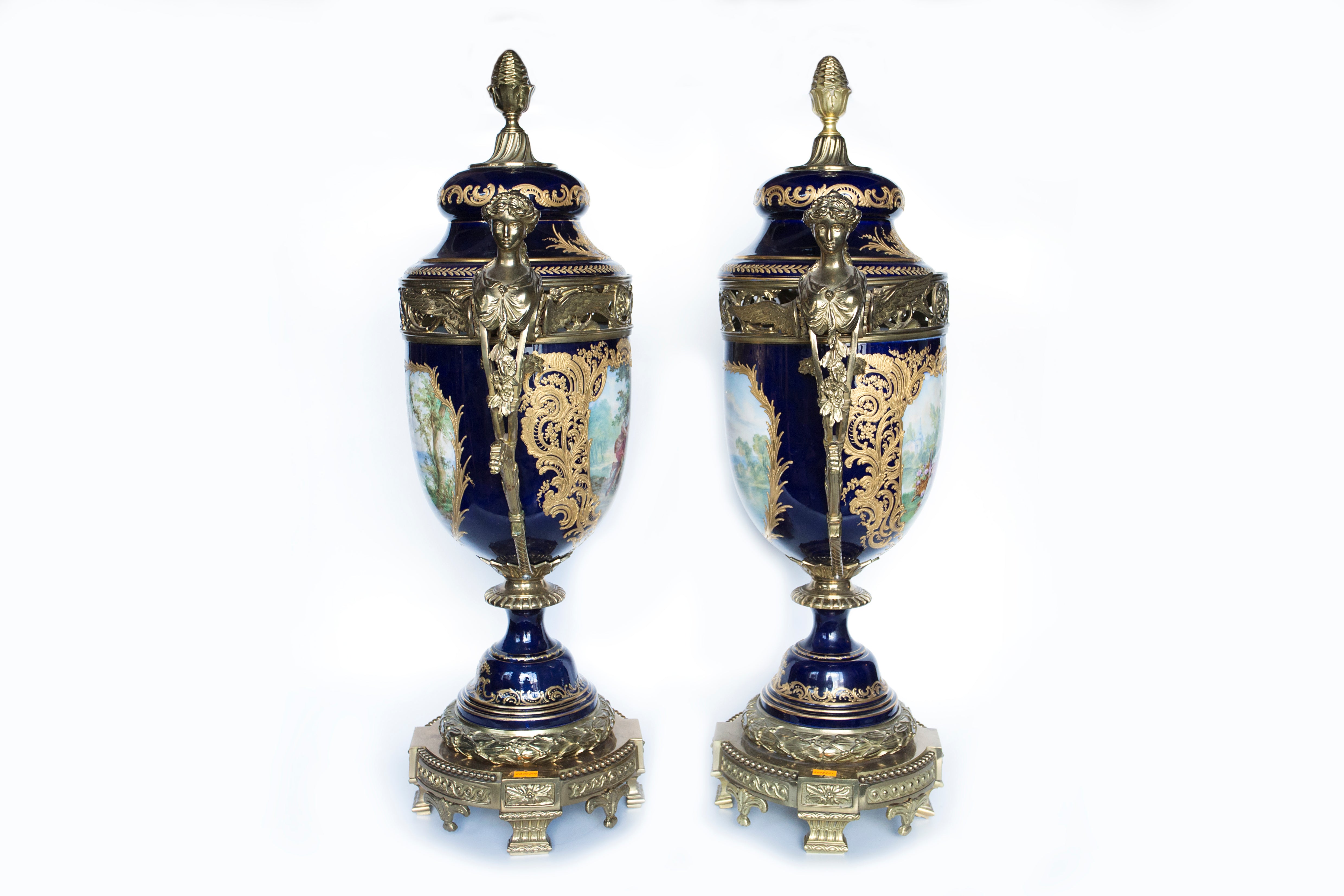 Set of two Sevres hand-painted soft-porcelain decorative vases