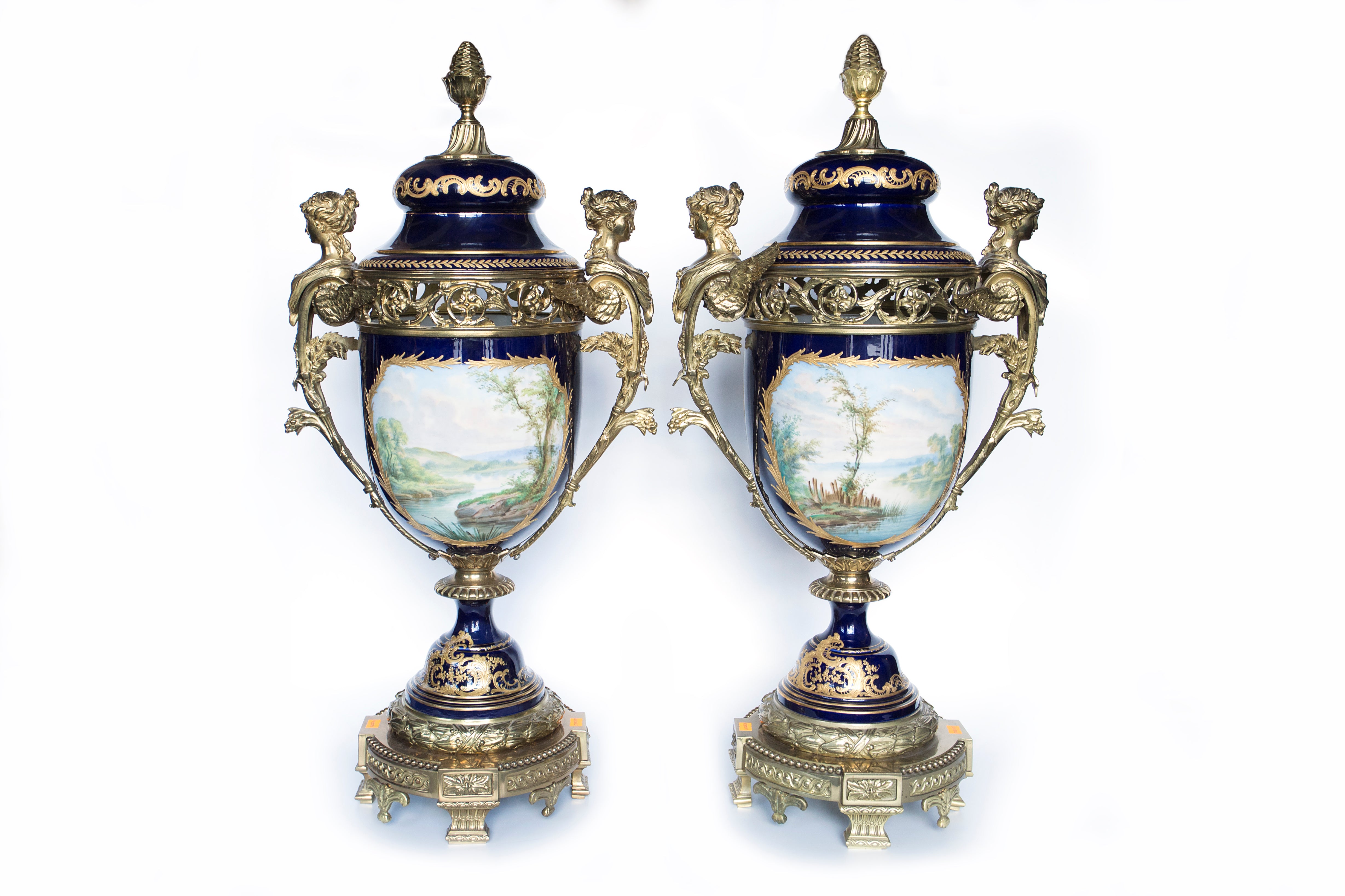 Set of two Sevres hand-painted soft-porcelain decorative vases