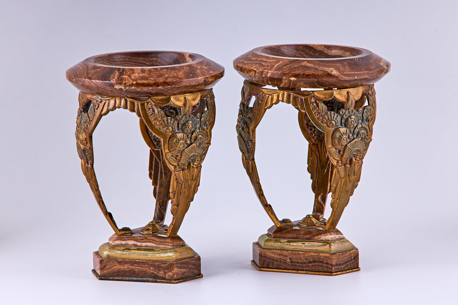 A pair of Art Deco bronze and marble decorative vases, bronze and marble