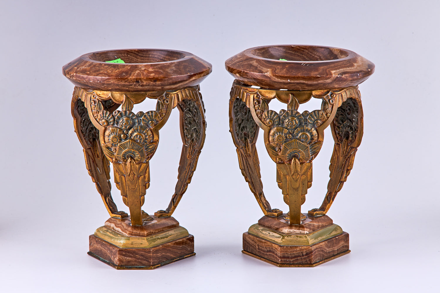 A pair of Art Deco bronze and marble decorative vases, bronze and marble