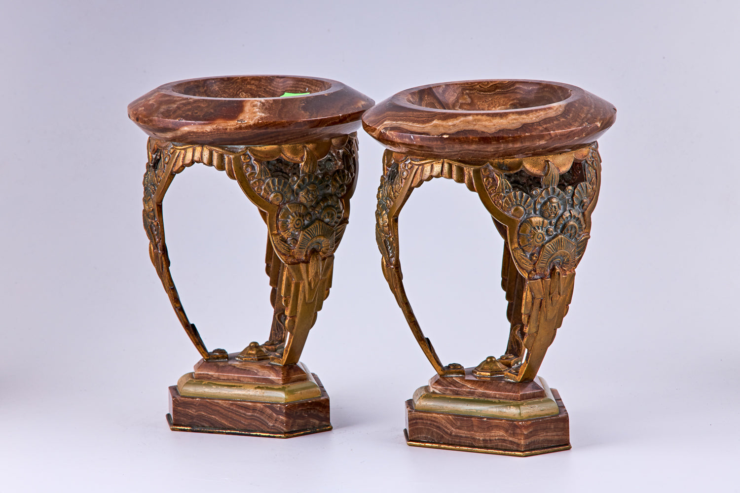 A pair of Art Deco bronze and marble decorative vases, bronze and marble