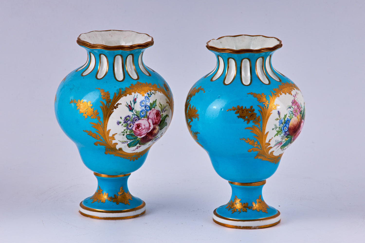 Pair of Sevres blue hand painted porcelain vases with polychromatic decoration