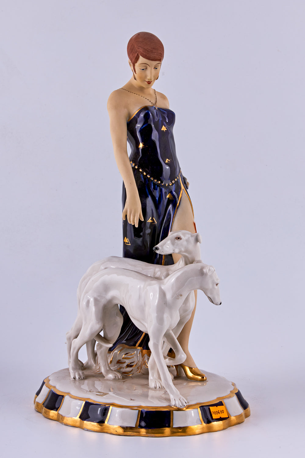 Porcelain Figurine of a “Flapper with two Borzoi dogs”