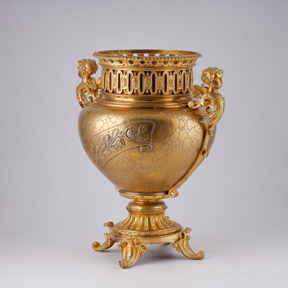 Gilt bronze large flower pot decorated with putti and floral motif