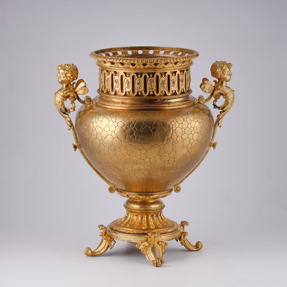 Gilt bronze large flower pot decorated with putti and floral motif