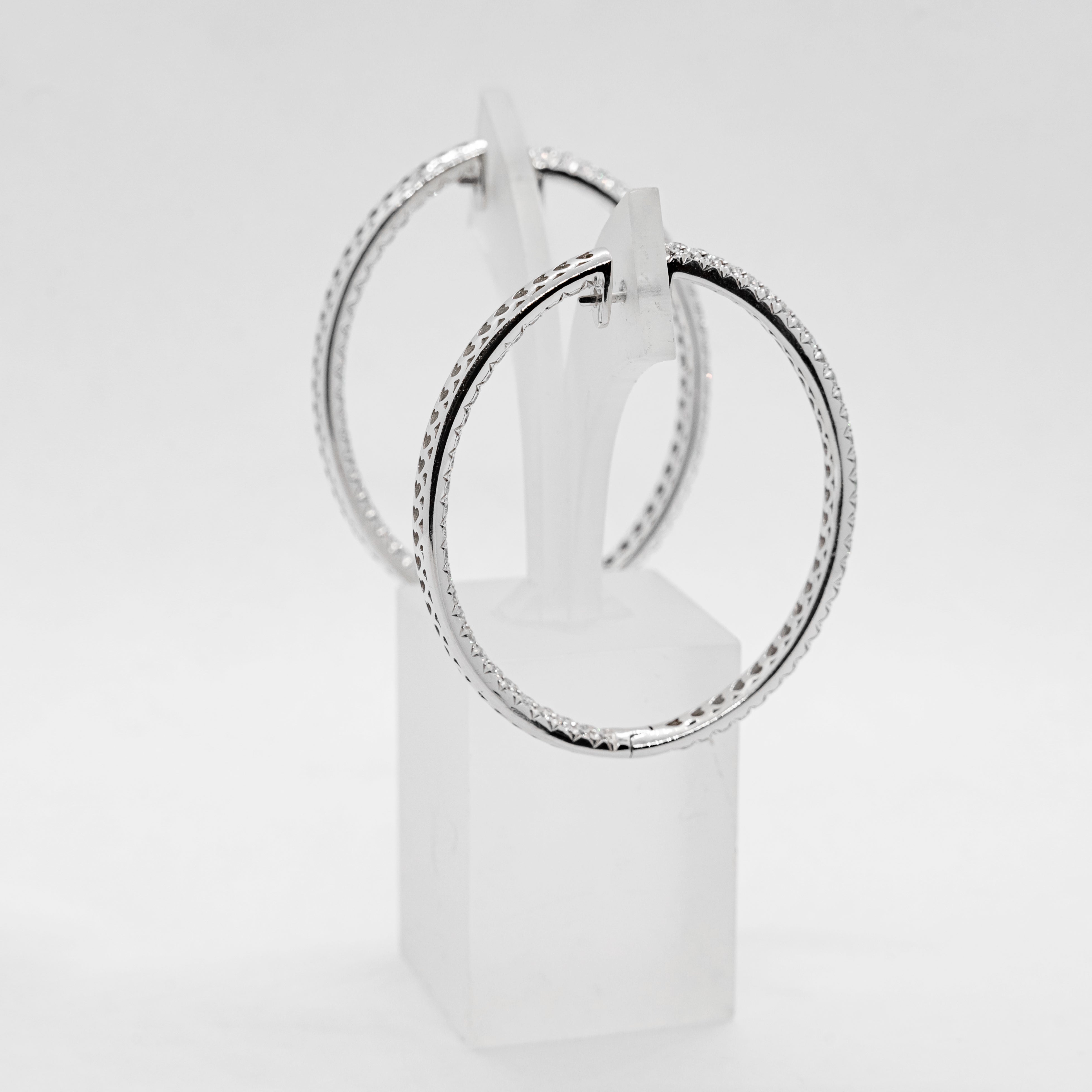 18k white gold hoop earrings set with 6,4 TCW of natural diamonds