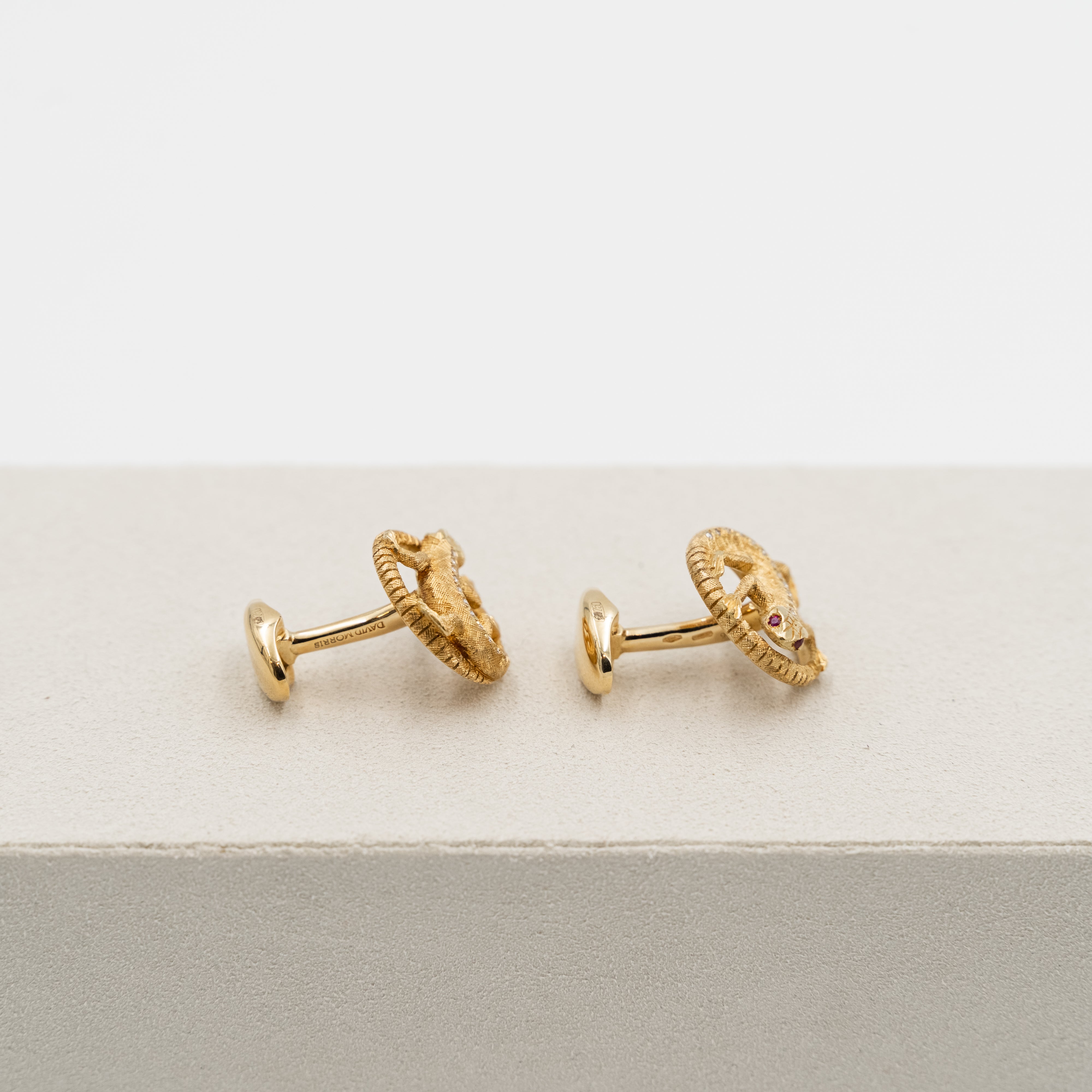 18k yellow gold David Morris cufflinks with a lizard design