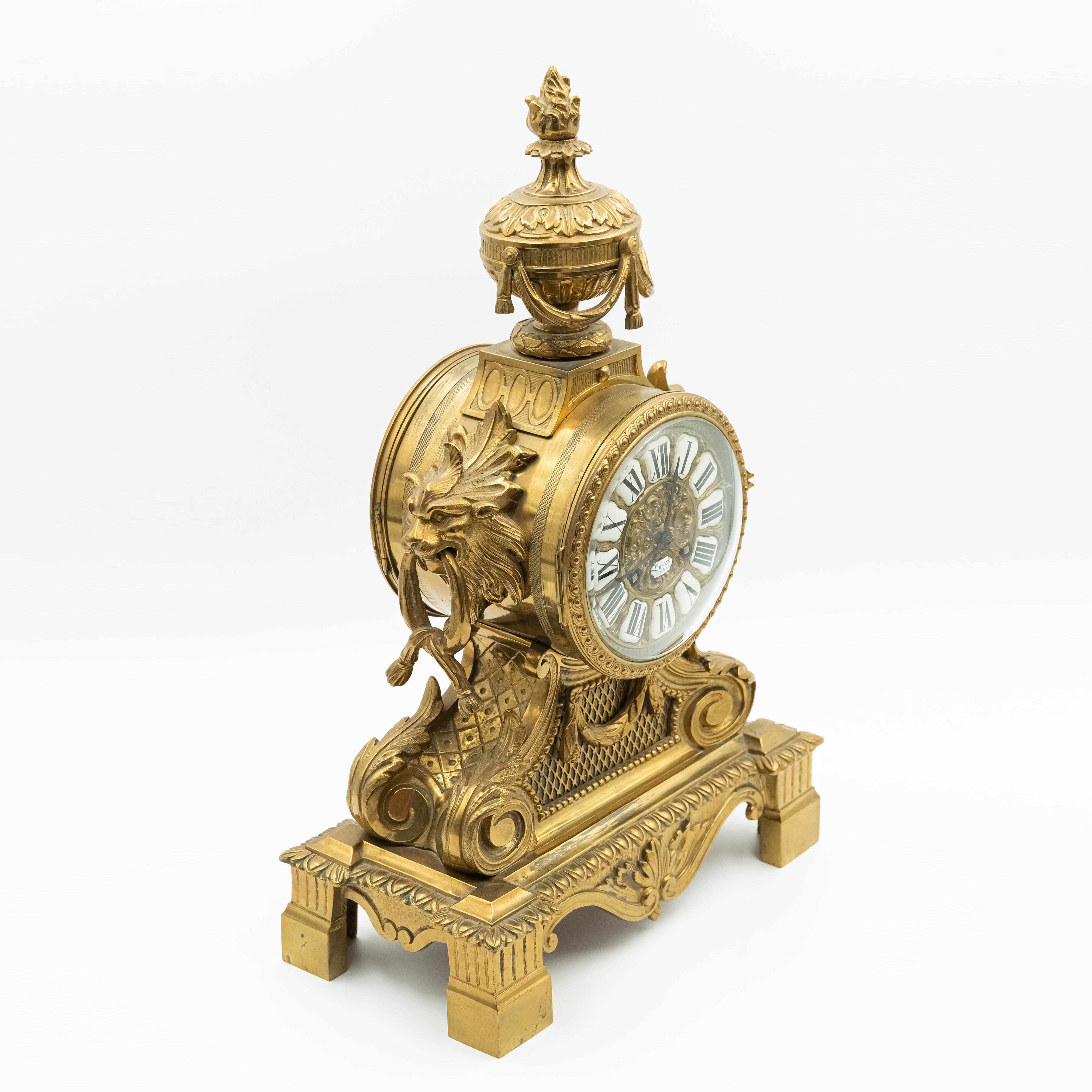 Antique Eclectic style bronze mantel clock with two candelabras in the style of Napoleon 3rd. decor