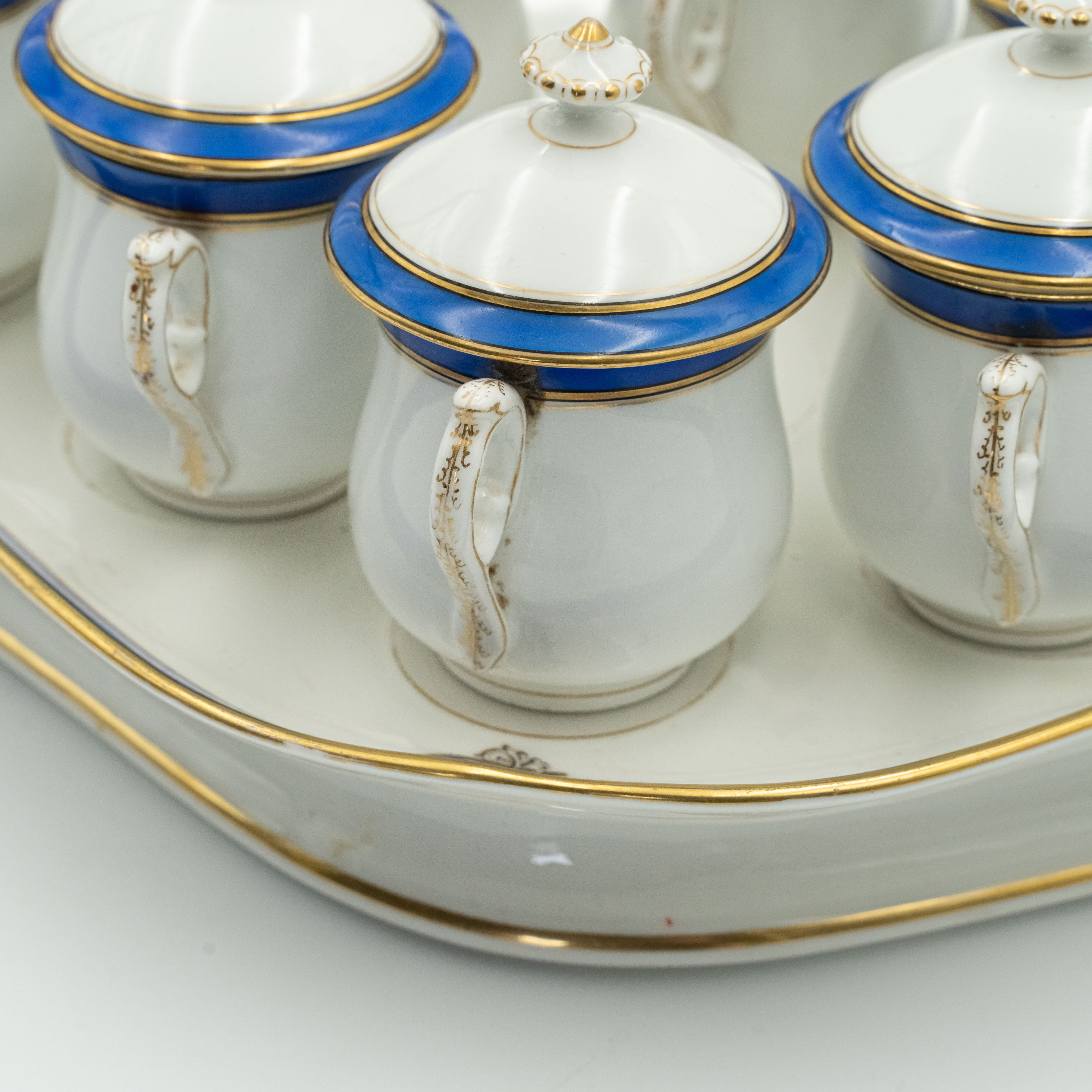 European porcelain set consisting of 9 hot chocolate cups on a serving tray