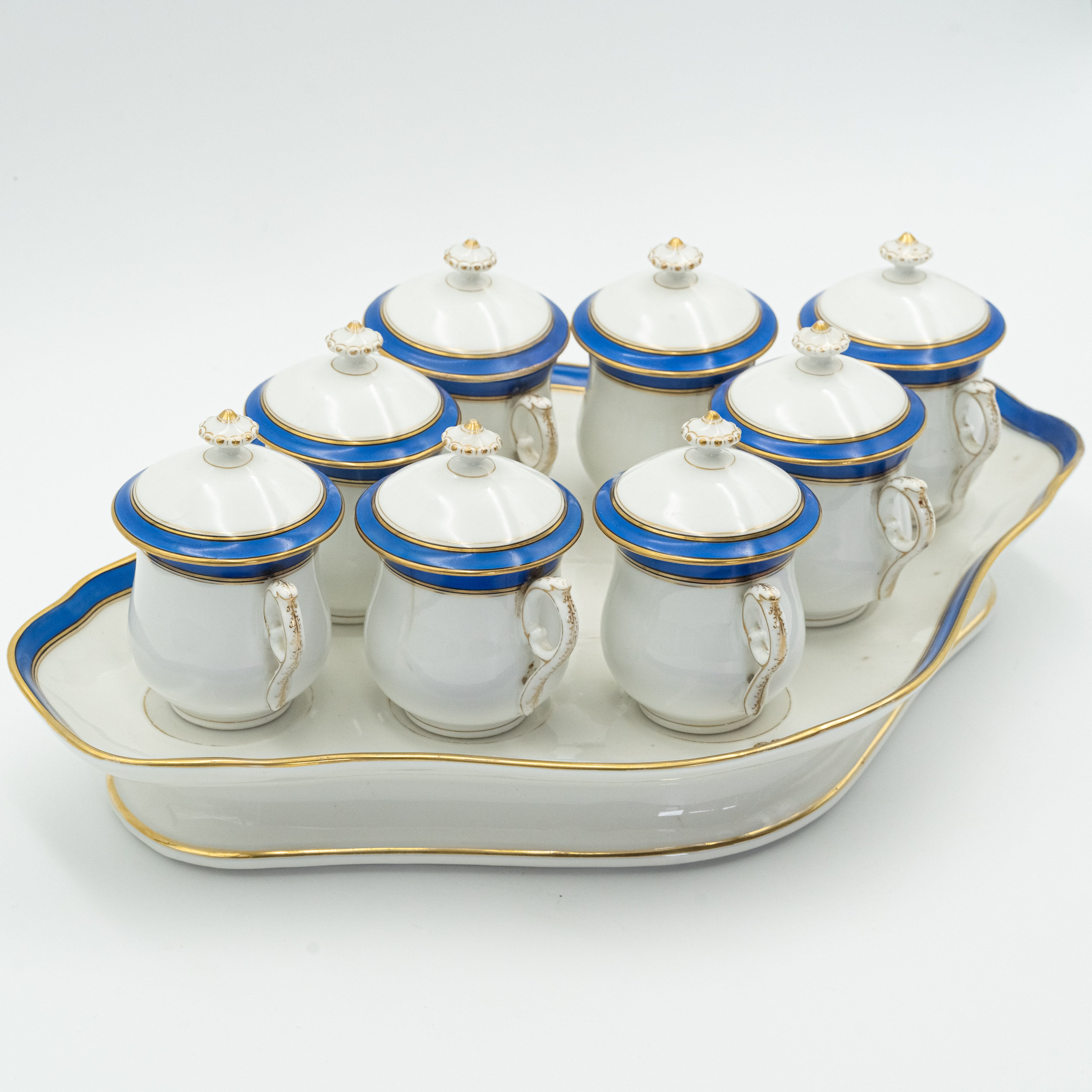 European porcelain set consisting of 9 hot chocolate cups on a serving tray