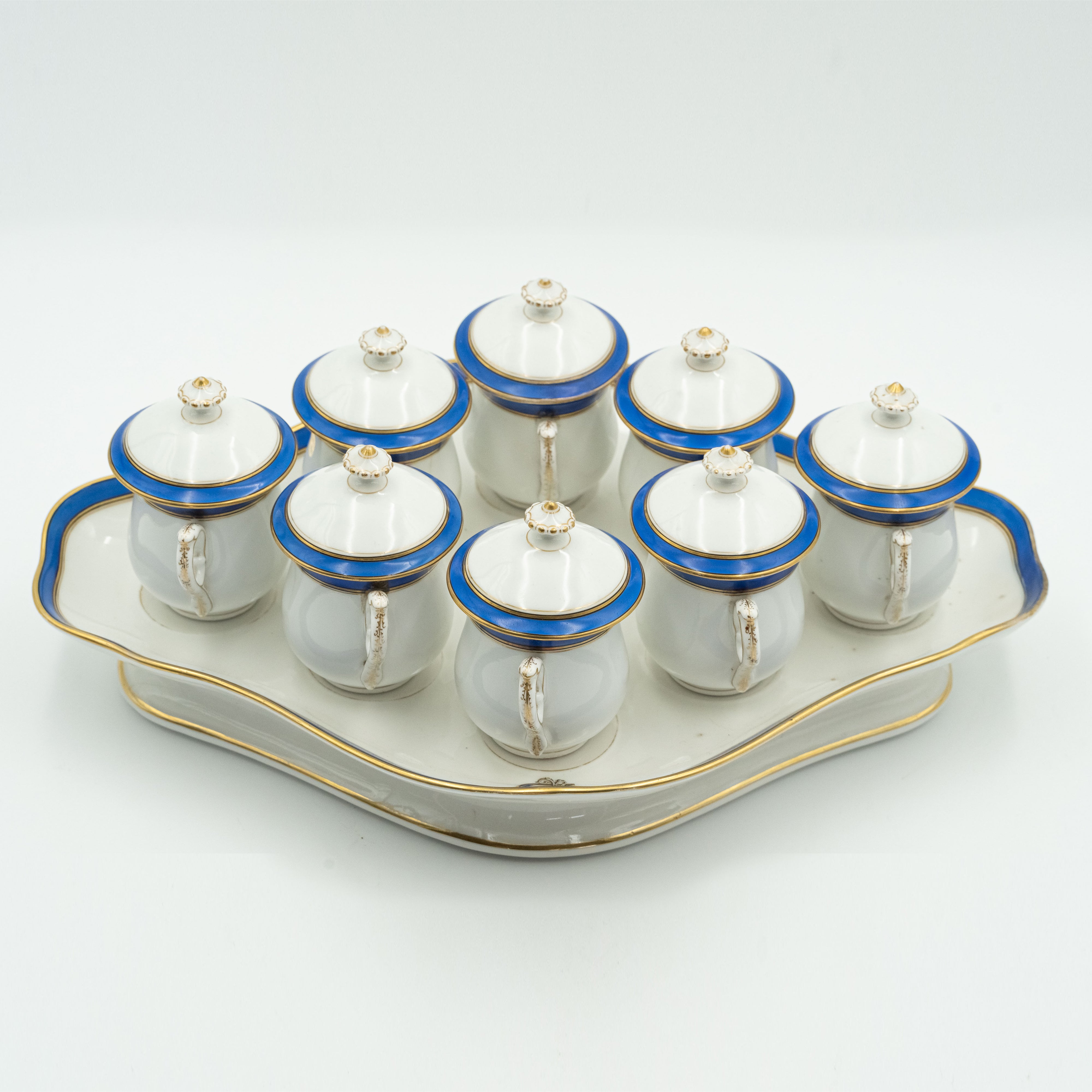 European porcelain set consisting of 9 hot chocolate cups on a serving tray