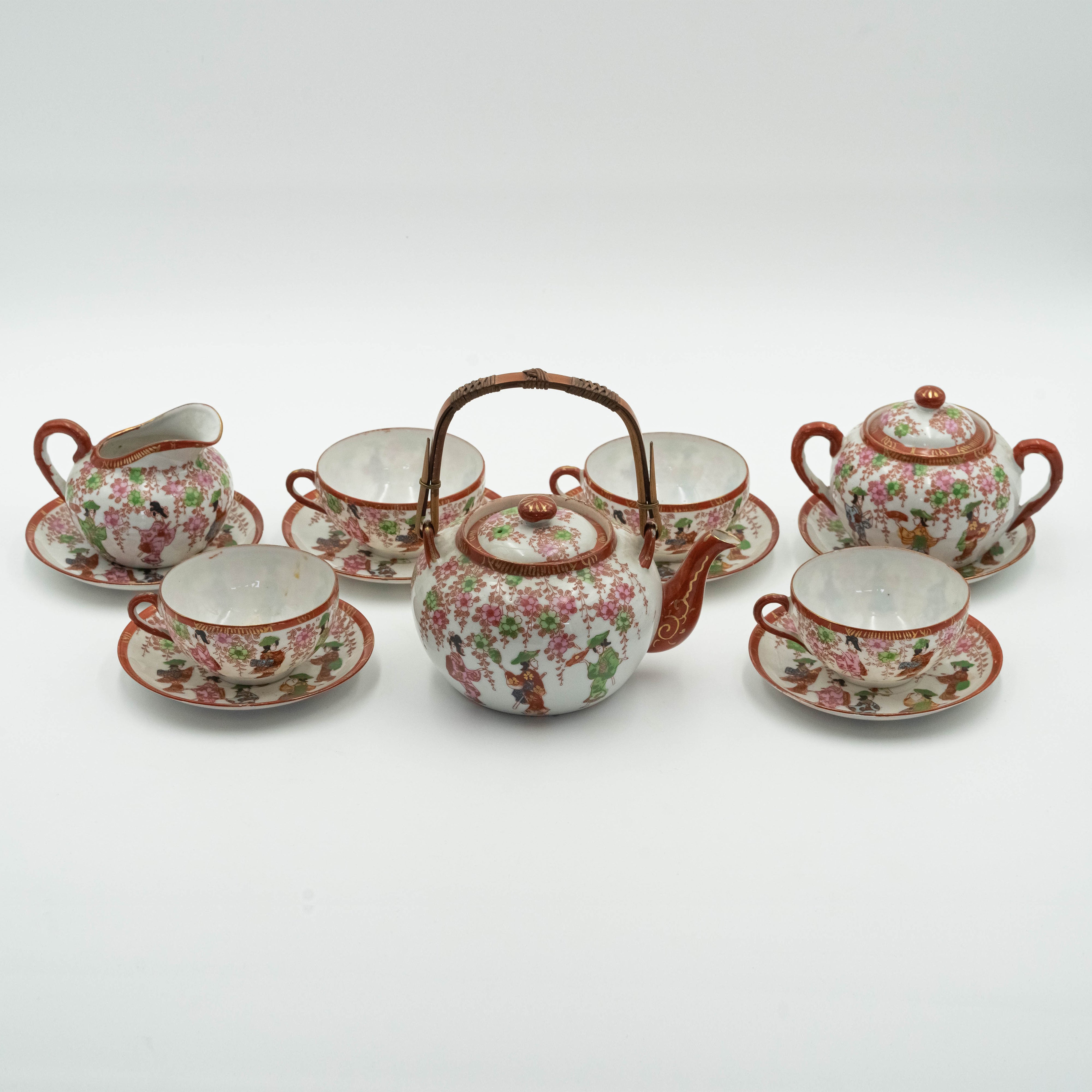 Antique Japanese fine porcelain tea set for 4 persons with hand-painted drawings of Geishas and Samurai