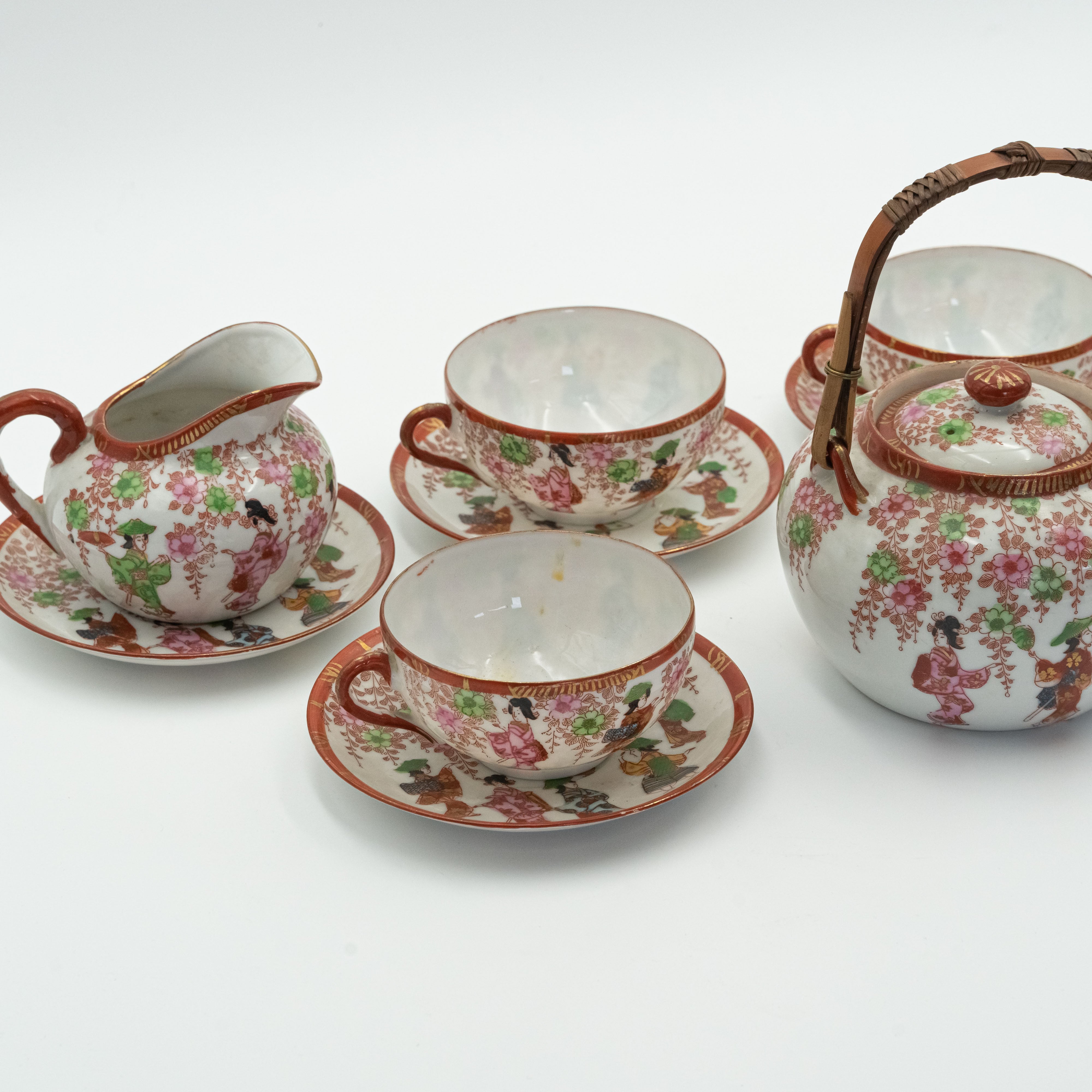 Antique Japanese fine porcelain tea set for 4 persons with hand-painted drawings of Geishas and Samurai