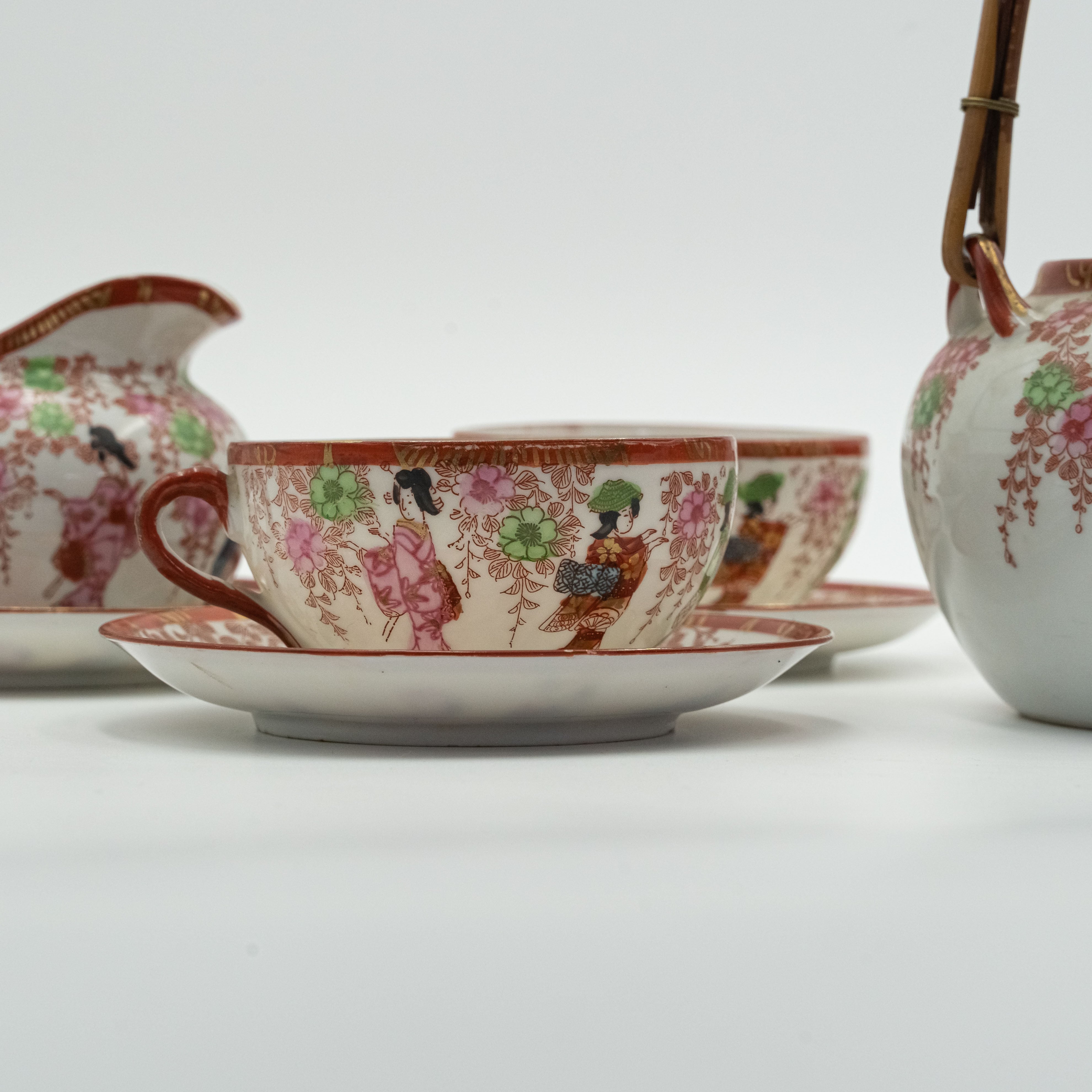 Antique Japanese fine porcelain tea set for 4 persons with hand-painted drawings of Geishas and Samurai