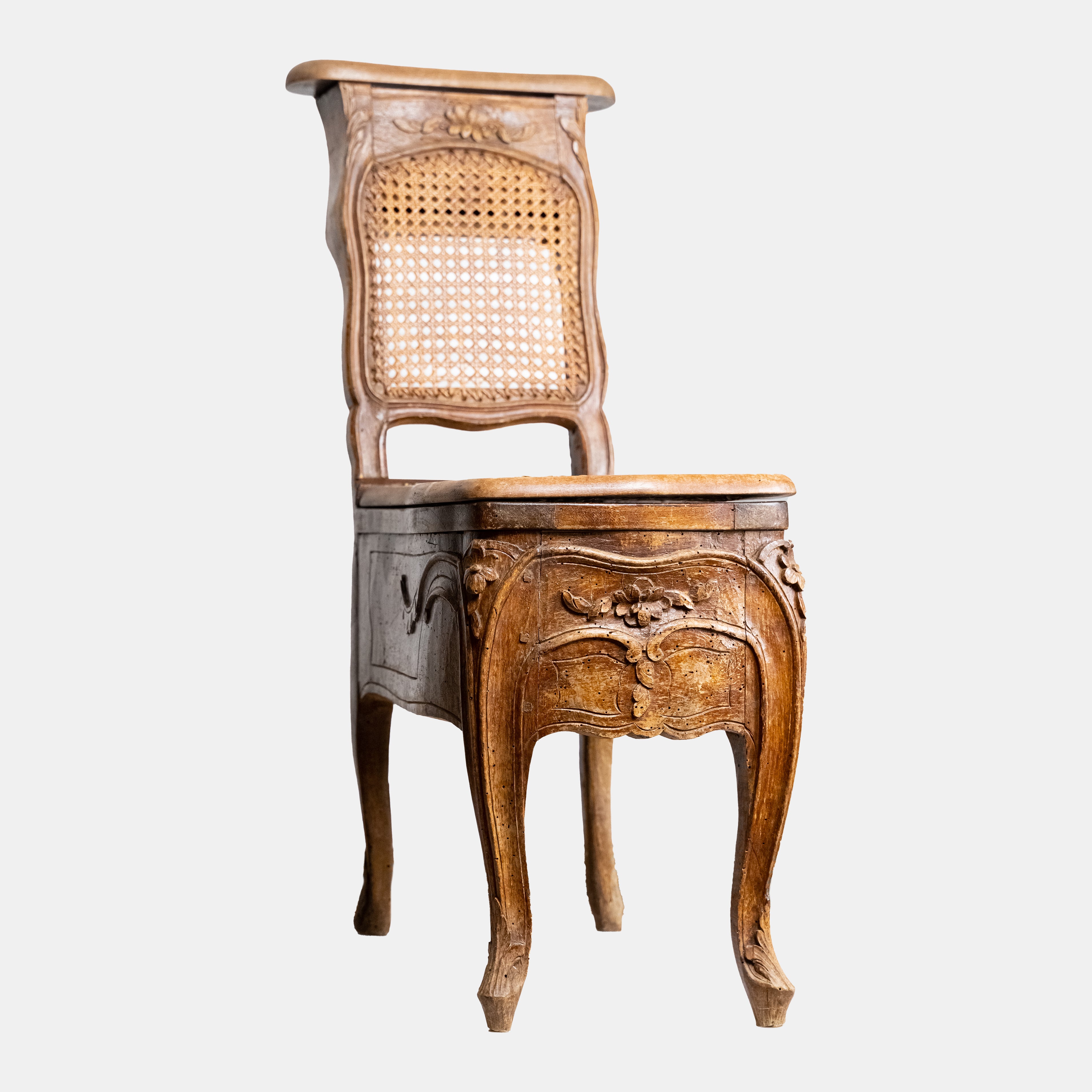 Exclusive and rare 19th-century bidet-chair decorated with floral ornaments with rattan weaving