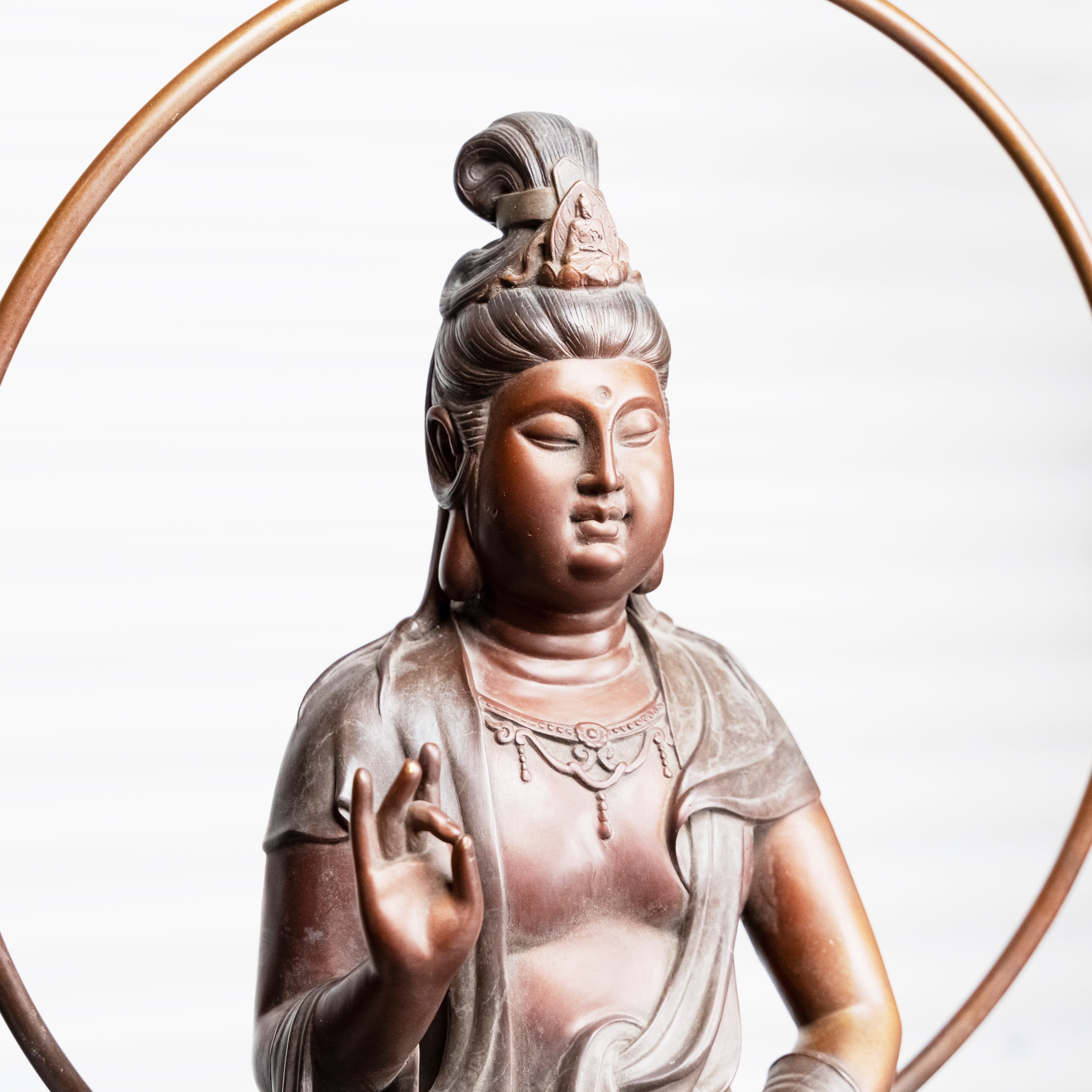 Antique bronze sculpture of the sitting Buddha in Shuni Mudra