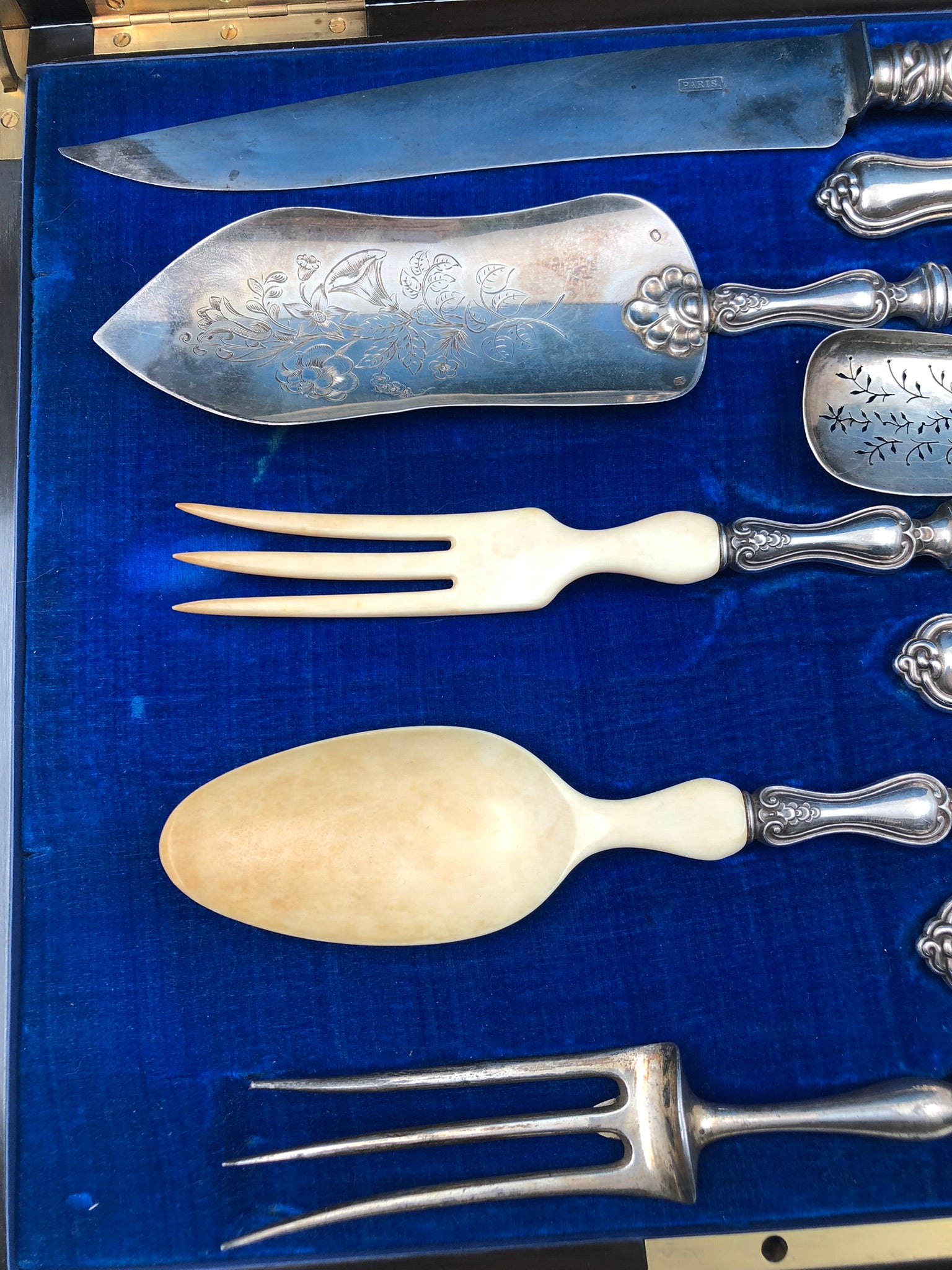 Antique 19th-century French silver set for a table setting with decorative welt patterns.