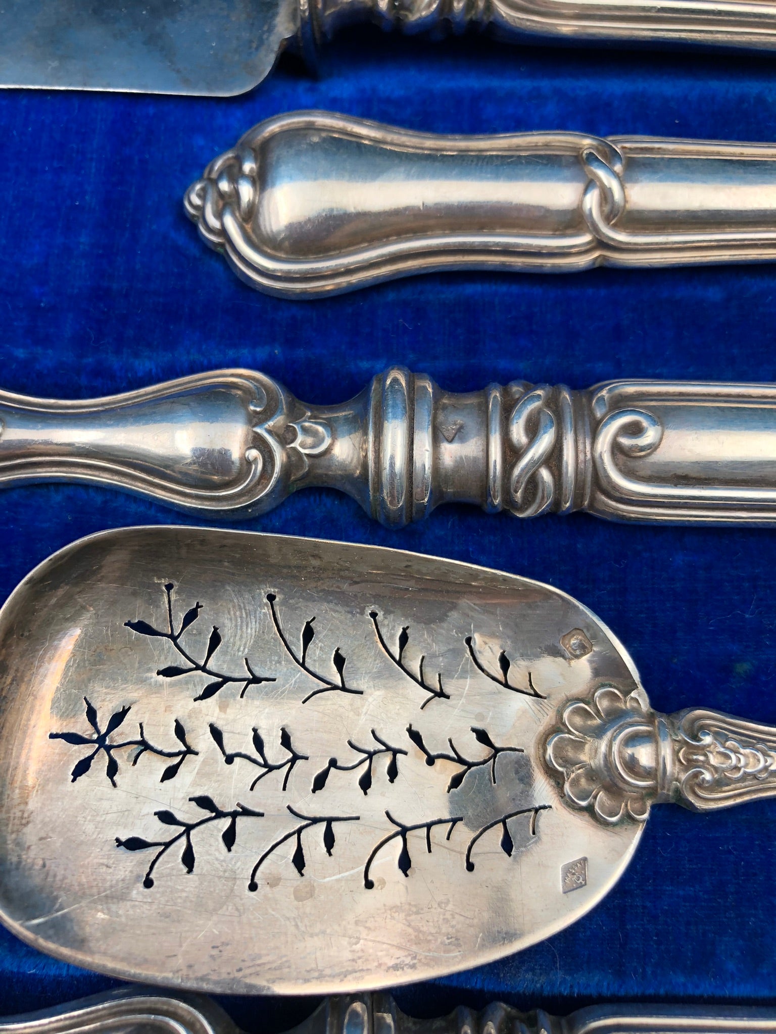 Antique 19th-century French silver set for a table setting with decorative welt patterns.